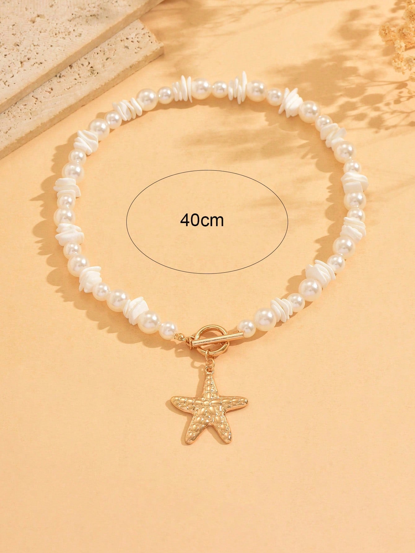 Collier ras du cou perles et pendentif étoile