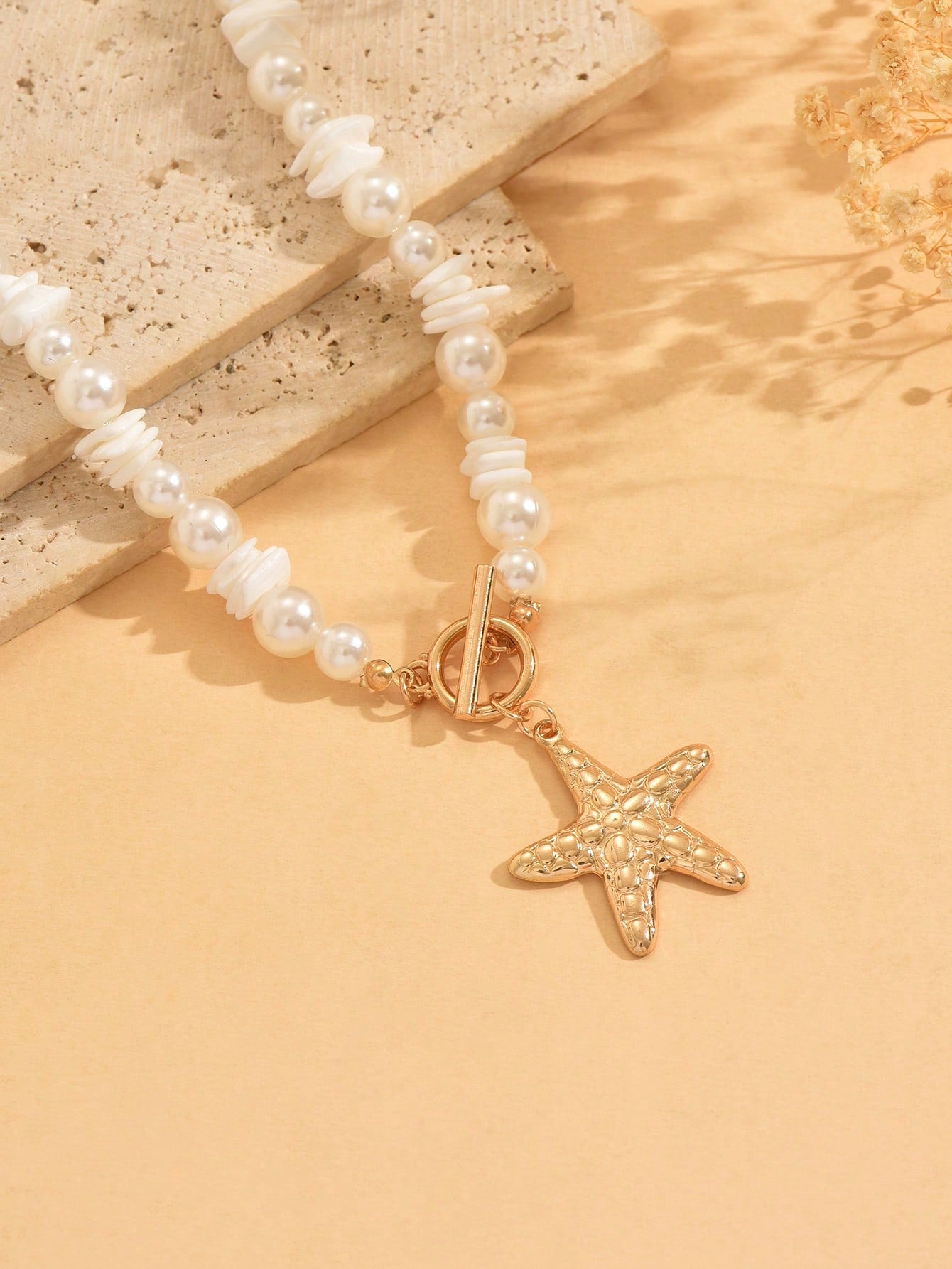Collier ras du cou perles et pendentif étoile