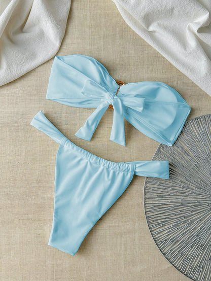 Bikini bandeau et string femme couleur unie avec déco métallique