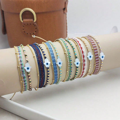 Bracelet tissé multicolore avec perles pour femme