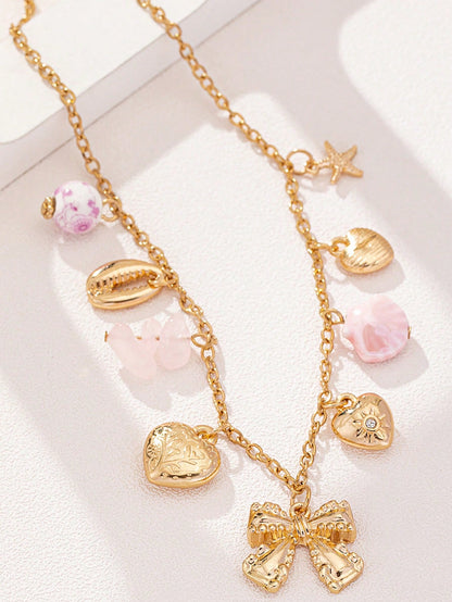 Collier punk vintage avec pendentifs multiples et nœud cœur