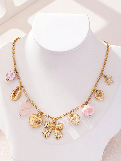 Collier punk vintage avec pendentifs multiples et nœud cœur