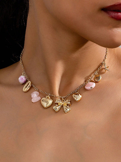 Collier punk vintage avec pendentifs multiples et nœud cœur