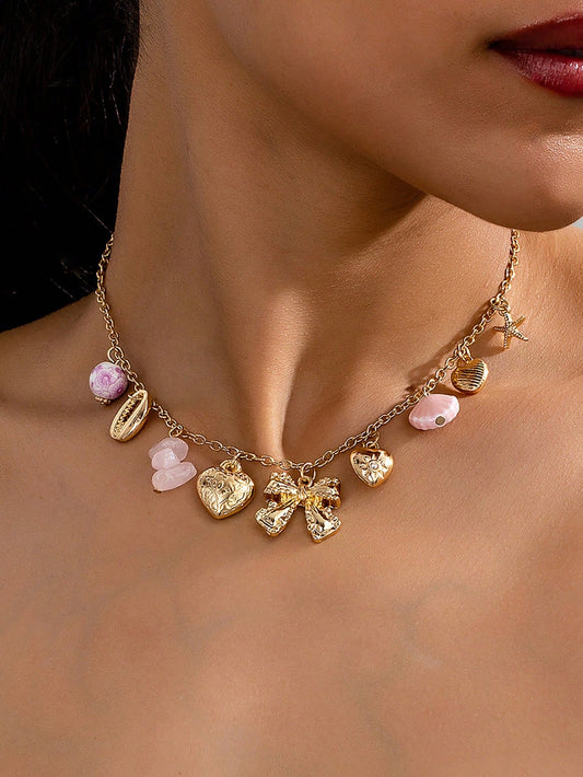 Collier punk vintage avec pendentifs multiples et nœud cœur