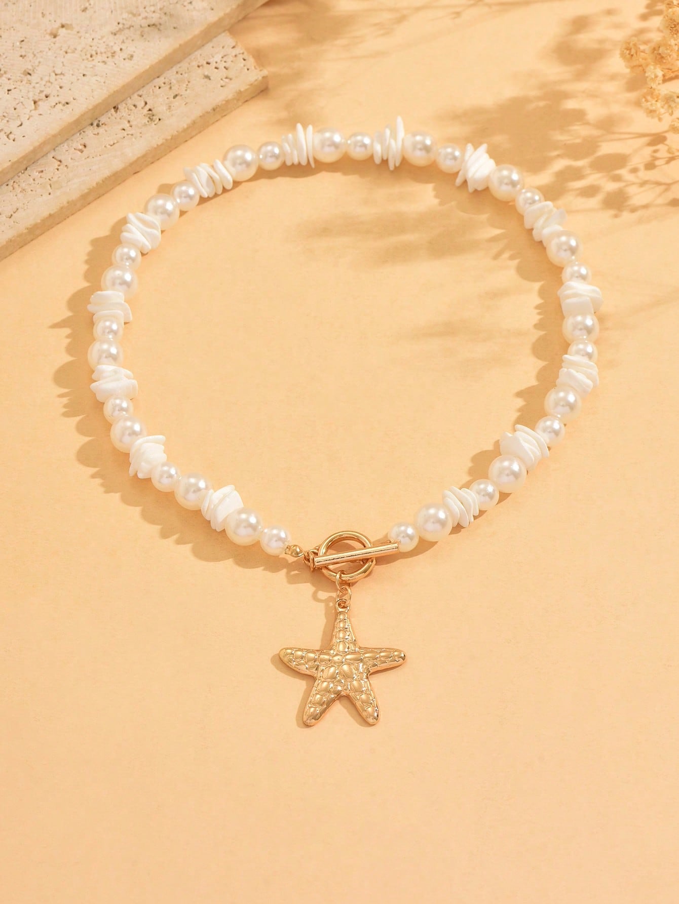 Collier ras du cou perles et pendentif étoile